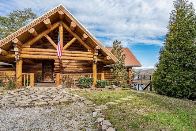 562 Rocky Ridge Rd E, Rock Island, TN 38581 - log-style house with log exterior and covered porch