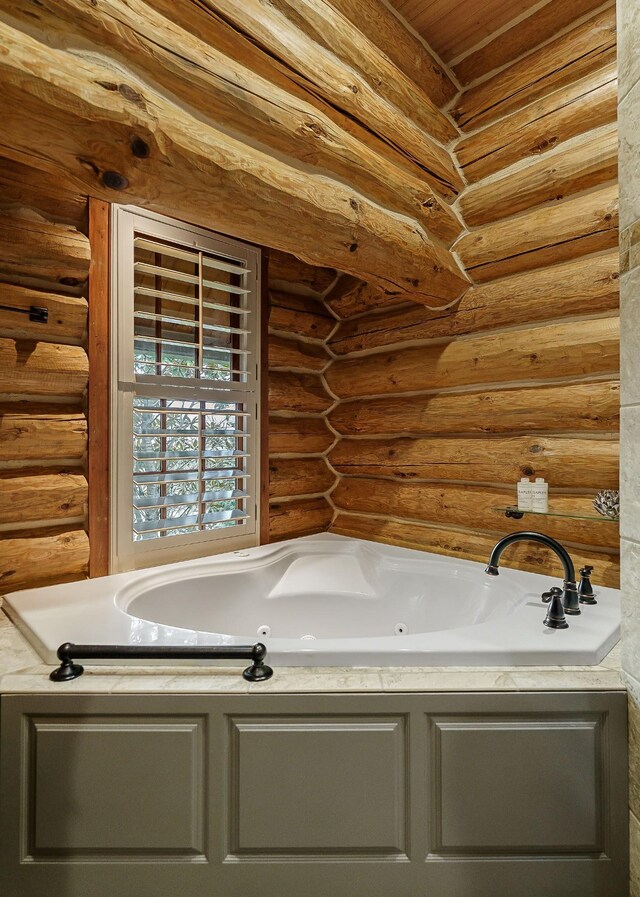 562 Rocky Ridge Rd E, Rock Island, TN 38581 - full bath with rustic walls and a whirlpool tub