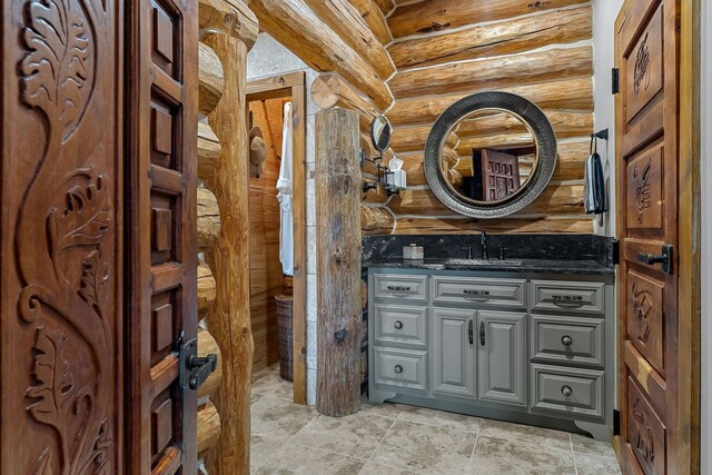 562 Rocky Ridge Rd E, Rock Island, TN 38581 - bathroom with vanity and rustic walls