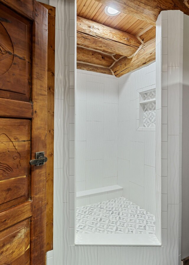 562 Rocky Ridge Rd E, Rock Island, TN 38581 - bathroom with a tile shower and wood ceiling with exposed beams