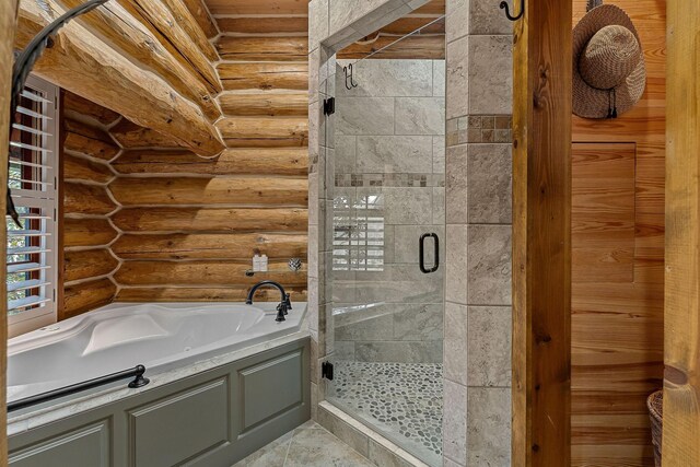 562 Rocky Ridge Rd E, Rock Island, TN 38581 - full bath with rustic walls, a bath, and a shower stall