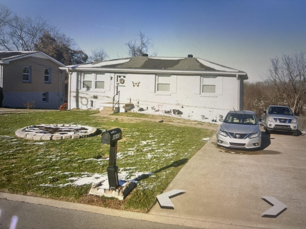 4640 Dowdy Dr, Antioch, TN 37013 - view of front of house with brick siding and a front lawn