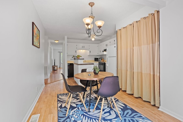 684 Dutchmans Dr, Hermitage, TN 37076 - dining space with light wood-type flooring, a chandelier, and baseboards