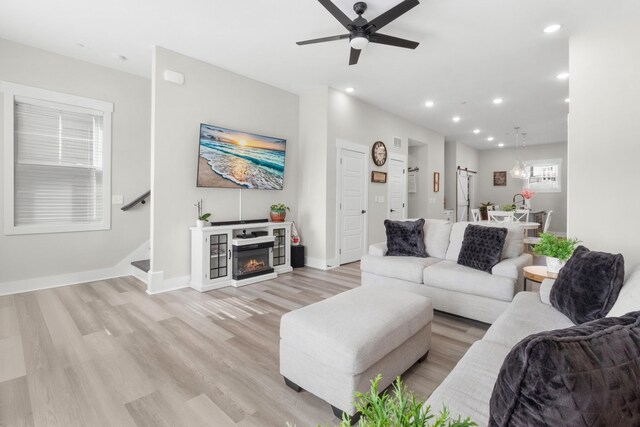 207 Charleston Ave, Pleasant View, TN 37146 - living room featuring light wood finished floors, ceiling fan, recessed lighting, stairs, and baseboards