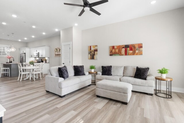 207 Charleston Ave, Pleasant View, TN 37146 - living room featuring light wood-style floors, ceiling fan, and recessed lighting