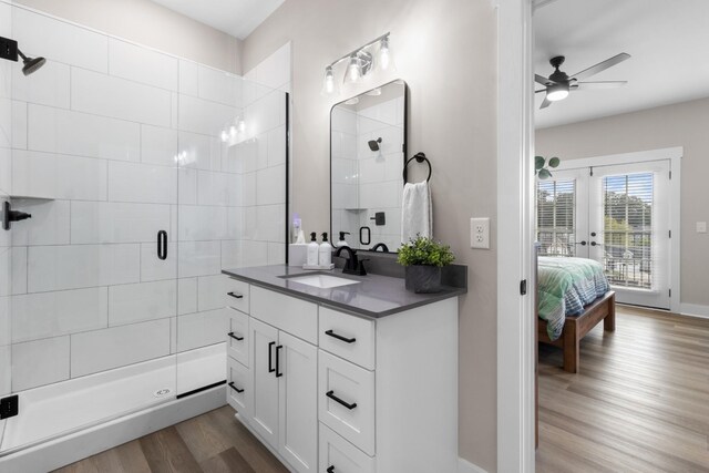 207 Charleston Ave, Pleasant View, TN 37146 - full bath featuring vanity, a stall shower, wood finished floors, ceiling fan, and connected bathroom
