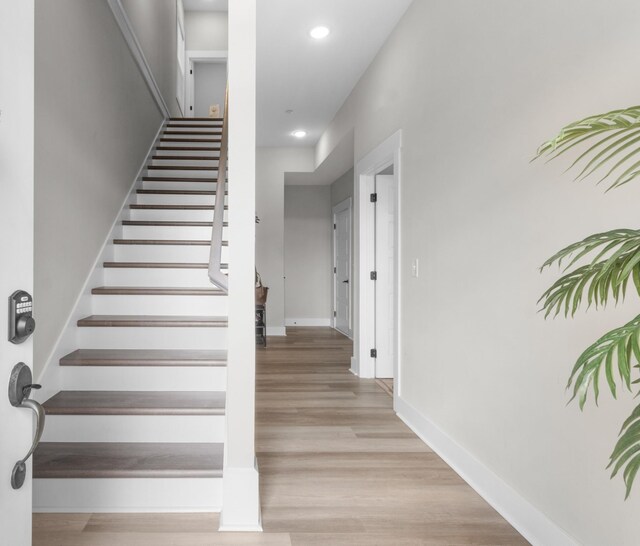 207 Charleston Ave, Pleasant View, TN 37146 - stairs featuring wood finished floors, baseboards, and recessed lighting