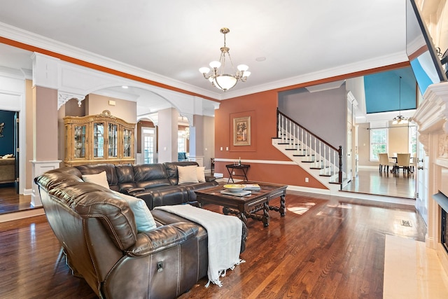 30 Park Mdws, Nashville, TN 37215 - living room with a chandelier, decorative columns, arched walkways, wood finished floors, and crown molding