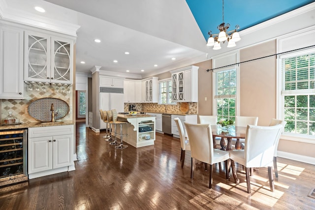 30 Park Mdws, Nashville, TN 37215 - dining room featuring wine cooler, healthy amount of natural light, a chandelier, wet bar, and recessed lighting