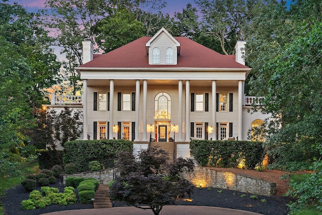 30 Park Mdws, Nashville, TN 37215 - greek revival inspired property featuring a chimney, a balcony, stucco siding, and a porch