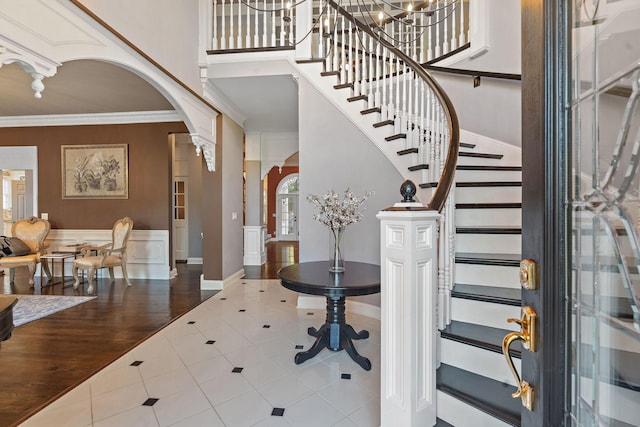 30 Park Mdws, Nashville, TN 37215 - entryway with arched walkways, tile patterned flooring, stairway, crown molding, and a high ceiling