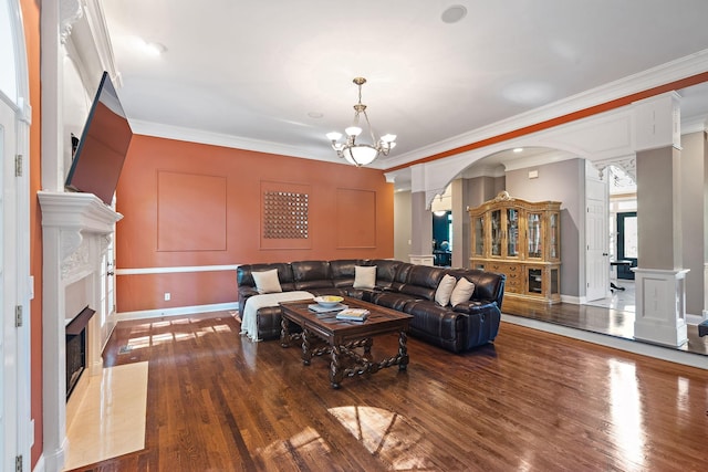 30 Park Mdws, Nashville, TN 37215 - living area with ornamental molding, a fireplace, wood finished floors, decorative columns, and arched walkways
