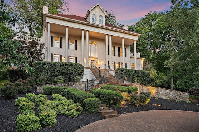 30 Park Mdws, Nashville, TN 37215 - greek revival inspired property featuring a chimney, stairway, covered porch, and stucco siding