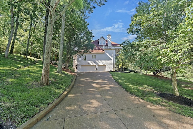 30 Park Mdws, Nashville, TN 37215 - obstructed view of property with an attached garage, concrete driveway, a chimney, and a front yard