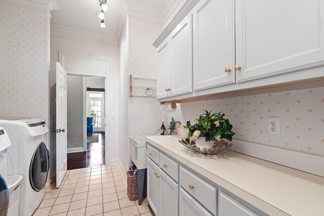 30 Park Mdws, Nashville, TN 37215 - washroom featuring wallpapered walls, light tile patterned floors, ornamental molding, washer and clothes dryer, and cabinet space