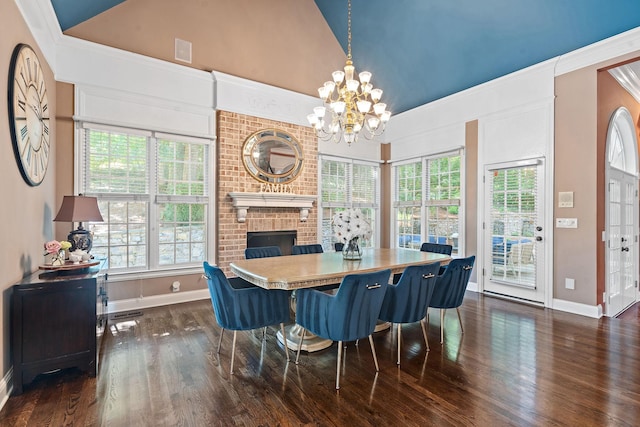 30 Park Mdws, Nashville, TN 37215 - dining area featuring vaulted ceiling, a chandelier, dark wood-style flooring, and a brick fireplace