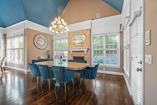 30 Park Mdws, Nashville, TN 37215 - dining space featuring vaulted ceiling, a chandelier, dark wood finished floors, and a fireplace