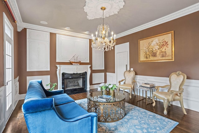 30 Park Mdws, Nashville, TN 37215 - living area with a chandelier, wood finished floors, a premium fireplace, wainscoting, and crown molding