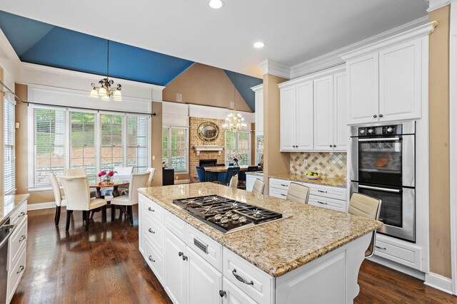 30 Park Mdws, Nashville, TN 37215 - kitchen with a chandelier, appliances with stainless steel finishes, lofted ceiling, dark wood-style floors, and decorative backsplash