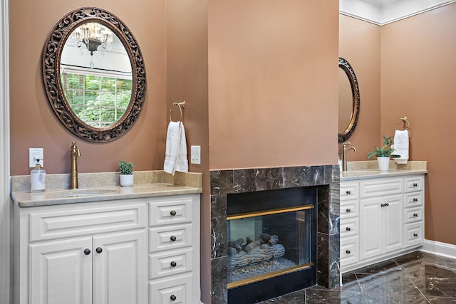30 Park Mdws, Nashville, TN 37215 - full bathroom with marble tiled floors, two vanities, and a fireplace