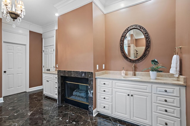 30 Park Mdws, Nashville, TN 37215 - full bathroom with ornamental molding, marble tiled flooring, vanity, a chandelier, and a premium fireplace
