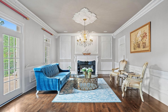 30 Park Mdws, Nashville, TN 37215 - living area featuring a chandelier, a decorative wall, wood finished floors, crown molding, and a wainscoted wall