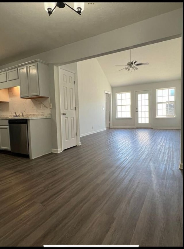 3715 Red Willow Ct, Murfreesboro, TN 37128 - kitchen featuring dishwasher, vaulted ceiling, dark wood-style floors, baseboards, and open floor plan