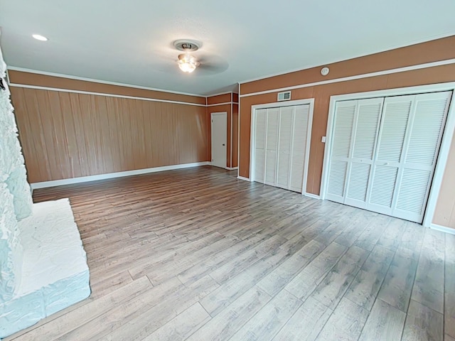 7 E Ln, Fayetteville, TN 37334 - unfurnished bedroom featuring wood finished floors, multiple closets, and baseboards