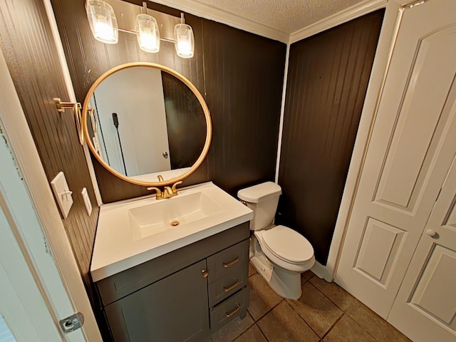 7 E Ln, Fayetteville, TN 37334 - bathroom with a textured ceiling, tile patterned floors, vanity, toilet, and wooden walls