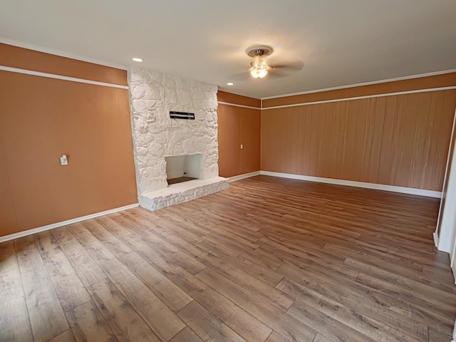 7 E Ln, Fayetteville, TN 37334 - unfurnished living room featuring ceiling fan, wood finished floors, a fireplace, baseboards, and crown molding