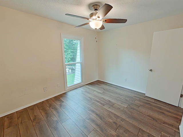 7 E Ln, Fayetteville, TN 37334 - spare room with a ceiling fan, wood-type flooring, a textured ceiling, and baseboards