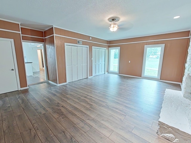 7 E Ln, Fayetteville, TN 37334 - unfurnished living room featuring dark wood finished floors, a ceiling fan, and a textured ceiling
