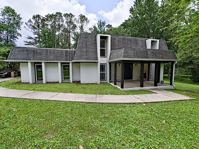7 E Ln, Fayetteville, TN 37334 - back of house featuring roof with shingles, a lawn, mansard roof, and a patio area