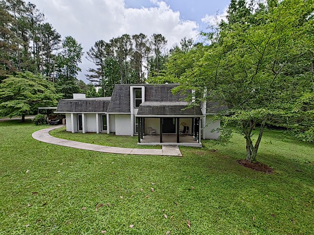 7 E Ln, Fayetteville, TN 37334 - rear view of property featuring a shingled roof and a lawn