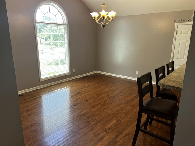 168 Commodore Cir, Summertown, TN 38483 - unfurnished dining area with a chandelier, healthy amount of natural light, dark wood-style floors, baseboards, and vaulted ceiling
