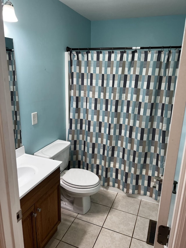 168 Commodore Cir, Summertown, TN 38483 - bathroom featuring tile patterned flooring, vanity, toilet, and curtained shower