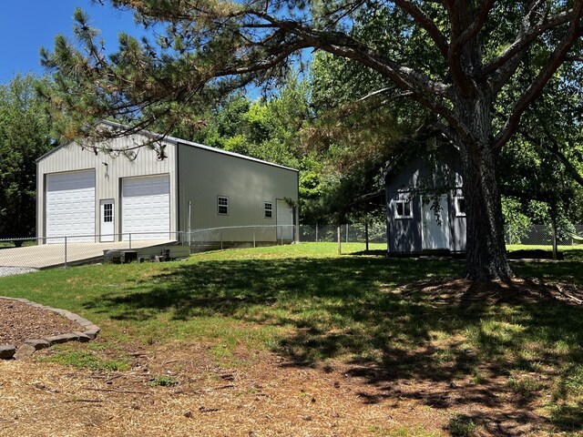 168 Commodore Cir, Summertown, TN 38483 - view of yard featuring an outbuilding and a garage