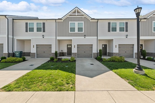 1342 Vilda Way Unit 300, Lebanon, TN 37087 - view of property featuring stone siding, a front lawn, an attached garage, and board and batten siding