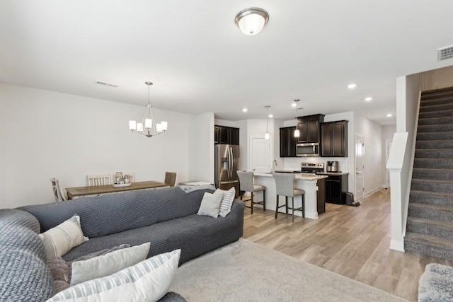 1342 Vilda Way Unit 300, Lebanon, TN 37087 - living area with stairway, a chandelier, light wood finished floors, and recessed lighting