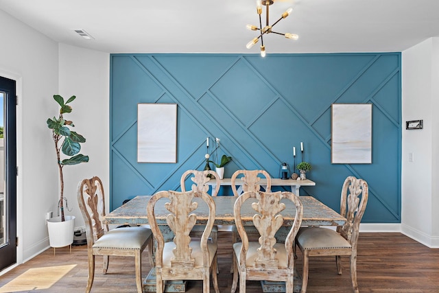 1246 June Wilde Rdg, Spring Hill, TN 37174 - dining room featuring a decorative wall, baseboards, a chandelier, and wood finished floors