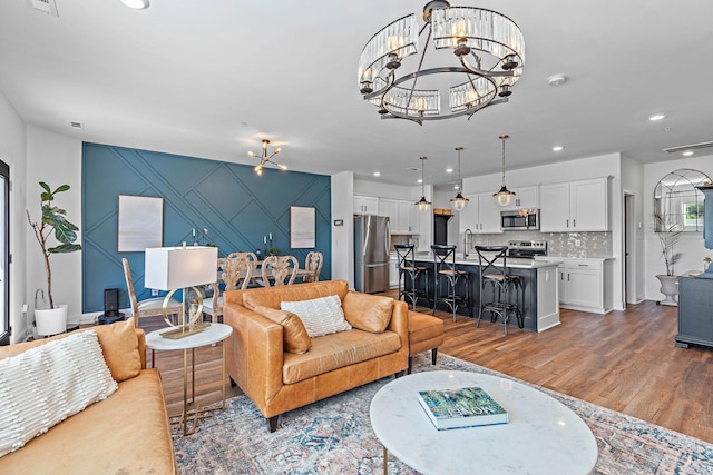 1246 June Wilde Rdg, Spring Hill, TN 37174 - living area featuring a chandelier, light wood finished floors, and recessed lighting