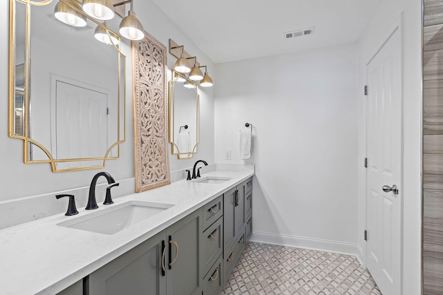 1246 June Wilde Rdg, Spring Hill, TN 37174 - full bathroom with double vanity, baseboards, and tile patterned floors