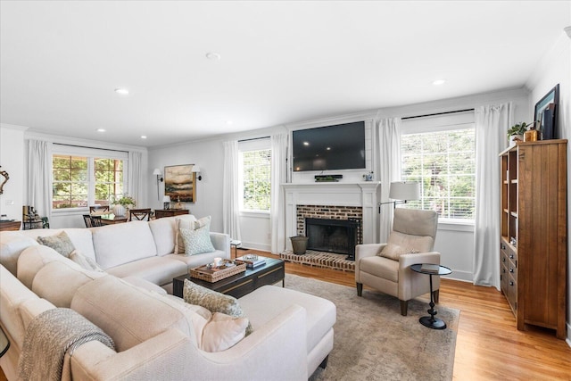 500 Beck Ave, Chattanooga, TN 37405 - living room featuring crown molding, light wood finished floors, a brick fireplace, and recessed lighting
