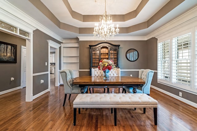 1205 Sequoya Trl, Columbia, TN 38401 - dining area featuring a chandelier, wood finished floors, and a raised ceiling