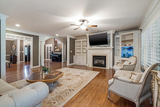 1205 Sequoya Trl, Columbia, TN 38401 - living room with arched walkways, decorative columns, a ceiling fan, ornamental molding, and recessed lighting