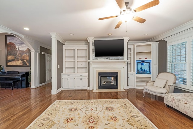 1205 Sequoya Trl, Columbia, TN 38401 - living room featuring ornamental molding, a fireplace with flush hearth, ceiling fan, wood finished floors, and built in features