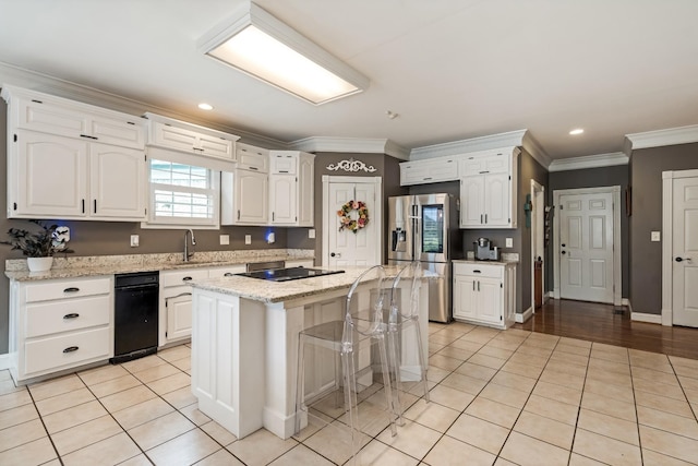1205 Sequoya Trl, Columbia, TN 38401 - kitchen with stainless steel fridge, white cabinetry, crown molding, a center island, and light tile patterned floors
