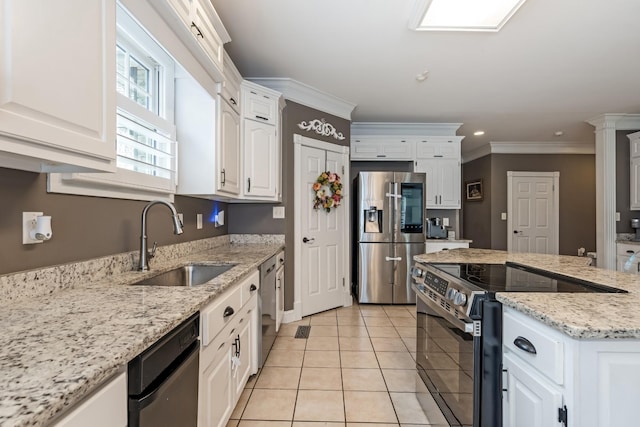 1205 Sequoya Trl, Columbia, TN 38401 - kitchen featuring appliances with stainless steel finishes, white cabinetry, light tile patterned floors, ornamental molding, and light stone countertops
