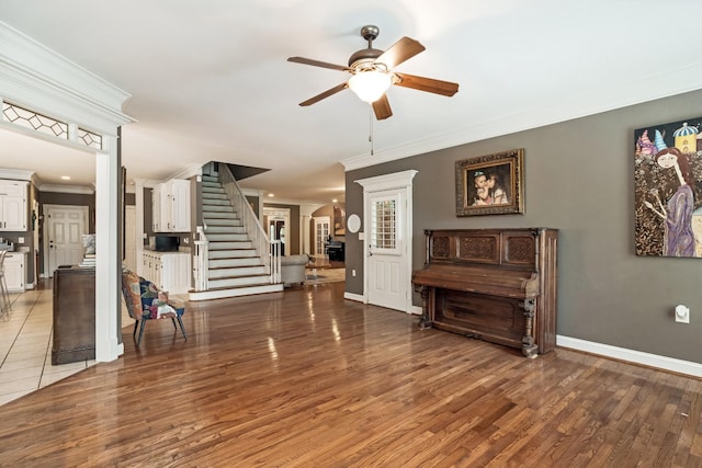 1205 Sequoya Trl, Columbia, TN 38401 - living area with stairs, a ceiling fan, ornamental molding, and wood finished floors