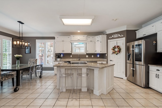 1205 Sequoya Trl, Columbia, TN 38401 - kitchen featuring smart refrigerator, a chandelier, light tile patterned flooring, crown molding, and white cabinetry